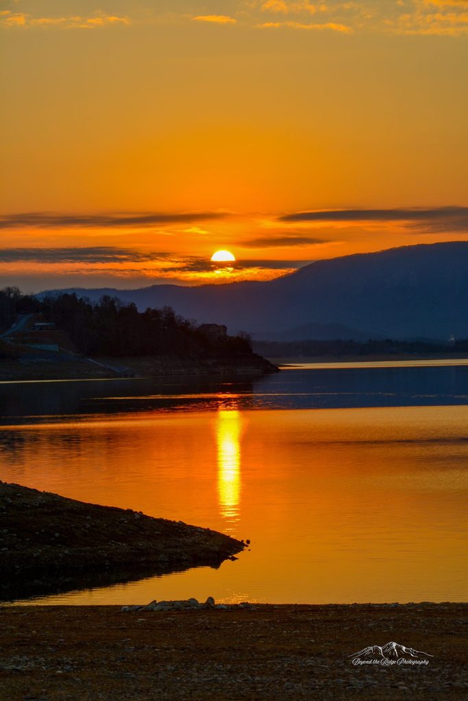 Sunset on Douglas Lake. Reflective water.
